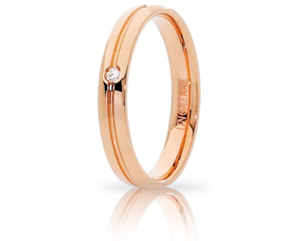 Fede Nuziale Unoaerre Lyra in oro rosa con diamante