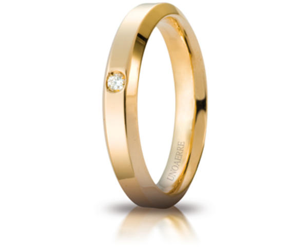 Fede Nuziale Unoaerre Hydra in oro giallo con diamante